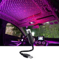 USB star projector lighting up a car roof with stars