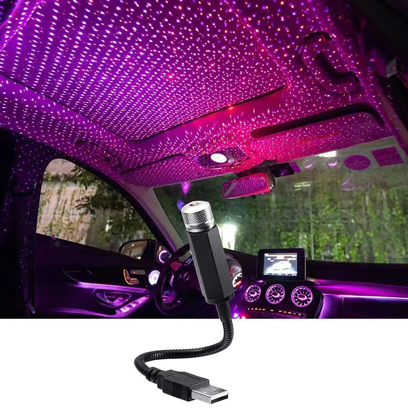 USB star projector lighting up a car roof with stars